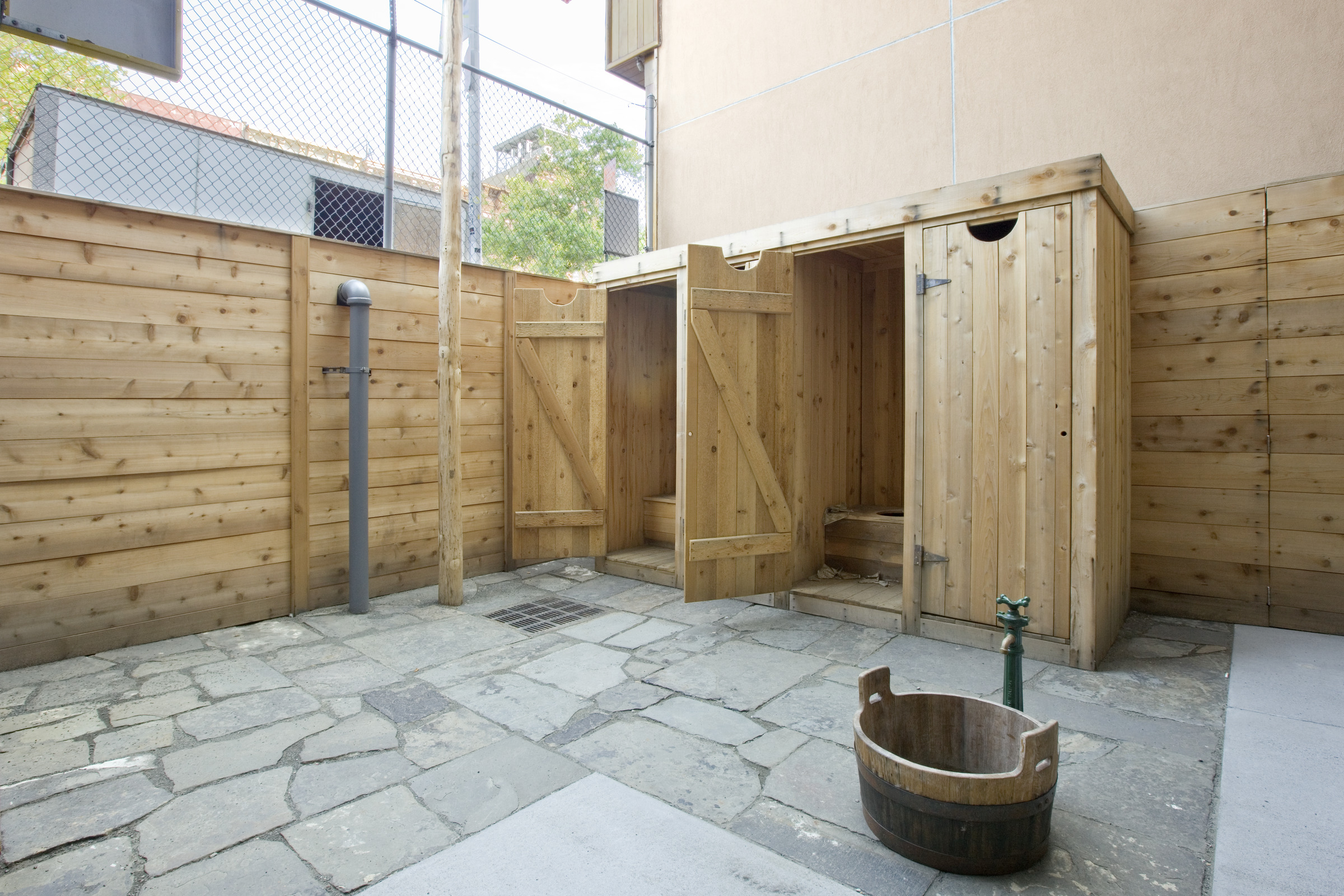 Tenement Museum: rear yard privy and water pump display