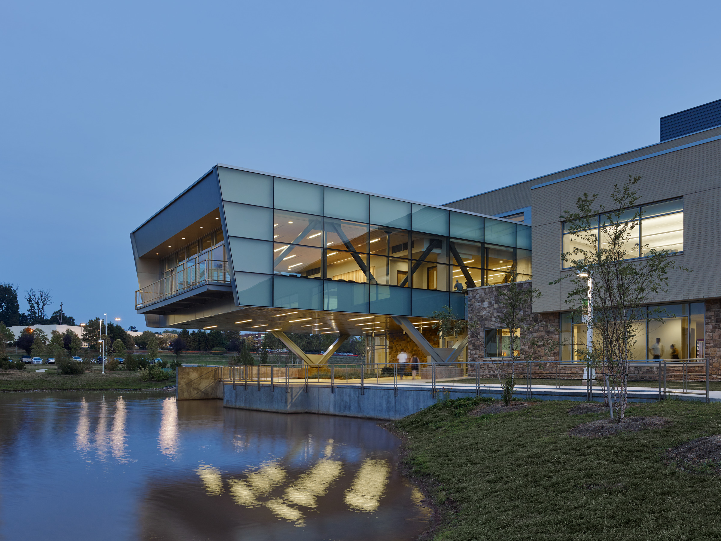 The Higher Education Center at Northern Virginia Community College's Loudoun County campus, designed by Perkins Eastman, features a glass volume that stretches out over the water. 